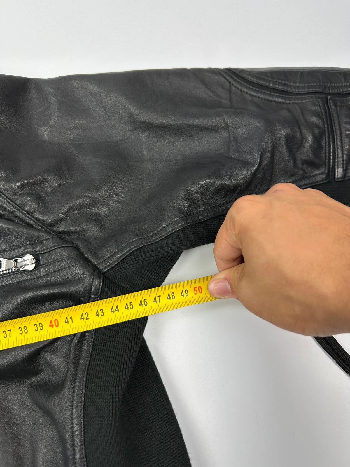 Prada black leather and cotton motor panel jacket with biker-style reinforced details.