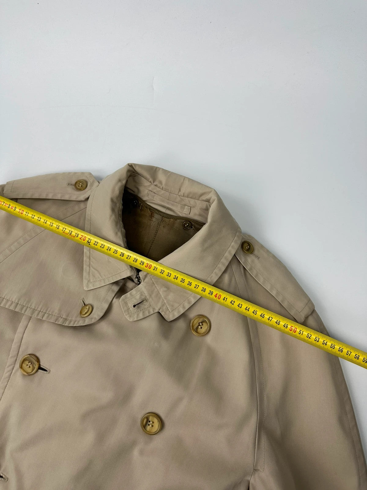 Burberrys beige trench coat jacket double breasted with removable lining and classic logo.