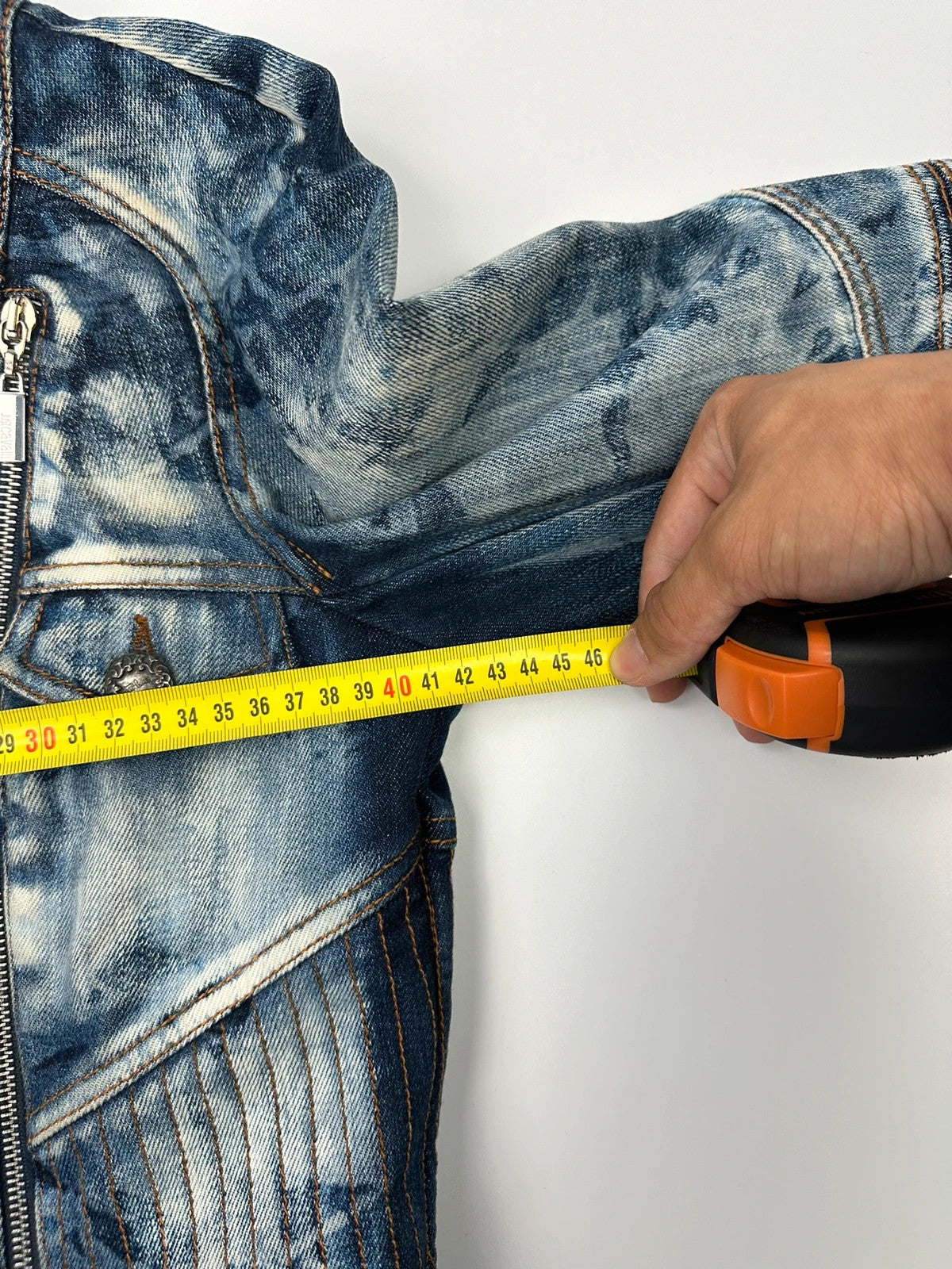 Just Cavalli sky blue denim jacket with multiple zippers and unique print design.