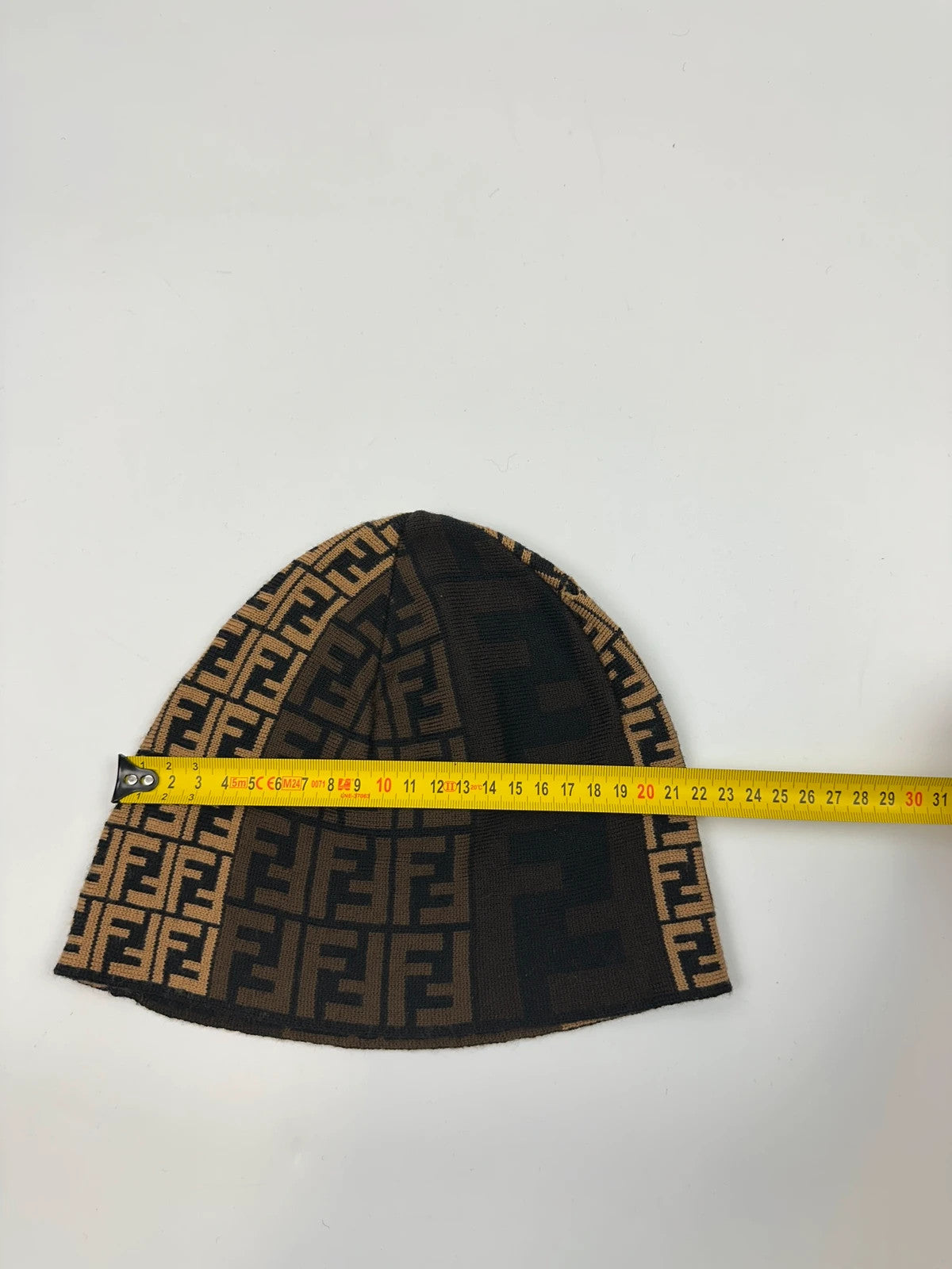 Fendi beige brown wool beanie with FF monogram pattern and vintage design.