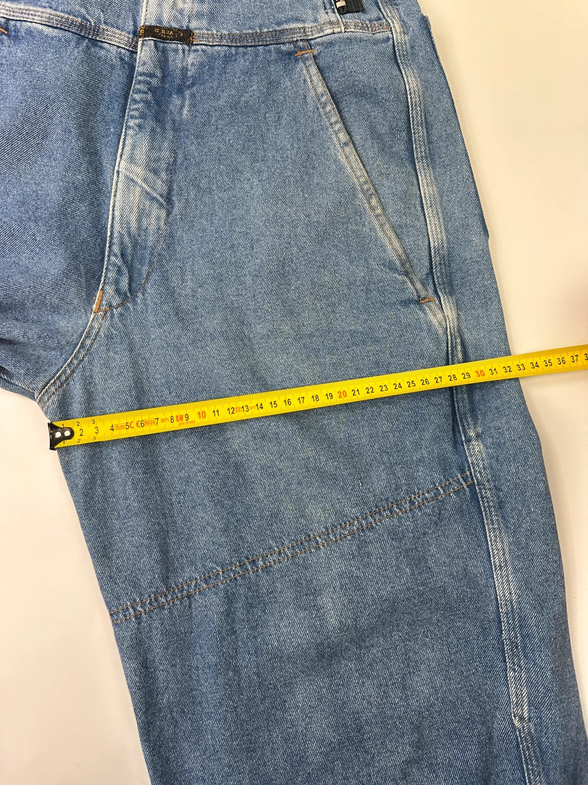 Marithé François Girbaud light blue high waisted wide leg jeans with stone washed finish.