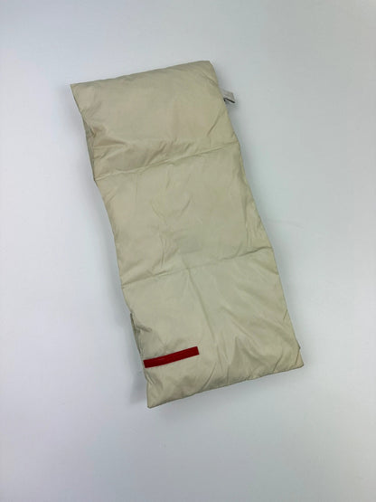 Prada beige puffer scarf with cream accents and magnetic closure, featuring signature logo.