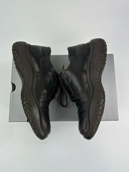 Prada black and brown leather loafer with Vibram puddle sole and moccasin design.