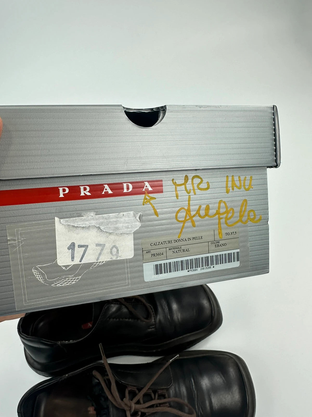 Prada black and brown leather loafer with Vibram puddle sole and moccasin design.