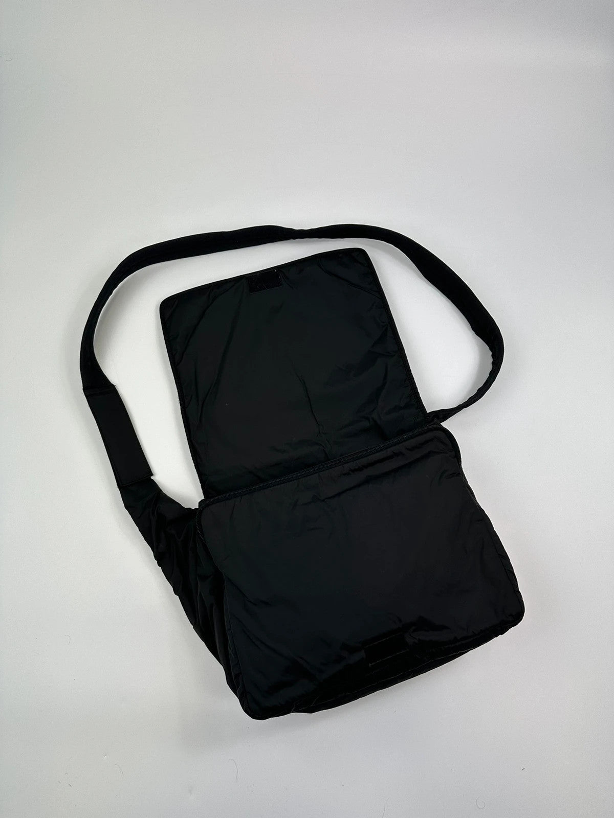 Prada black nylon crossbody bag with fur accents and linearossa logo.