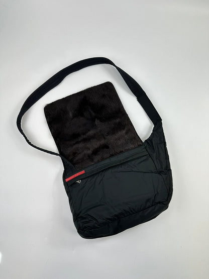Prada black nylon crossbody bag with fur accents and linearossa logo.