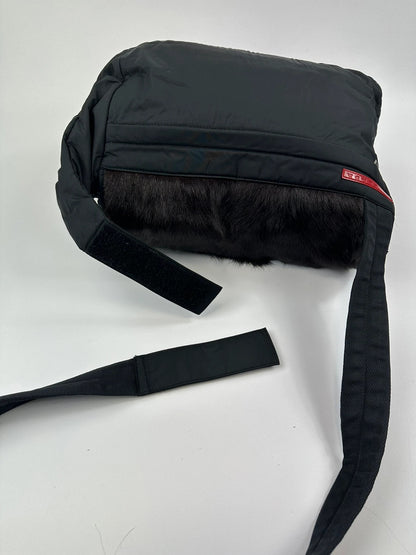 Prada black nylon crossbody bag with fur accents and linearossa logo.