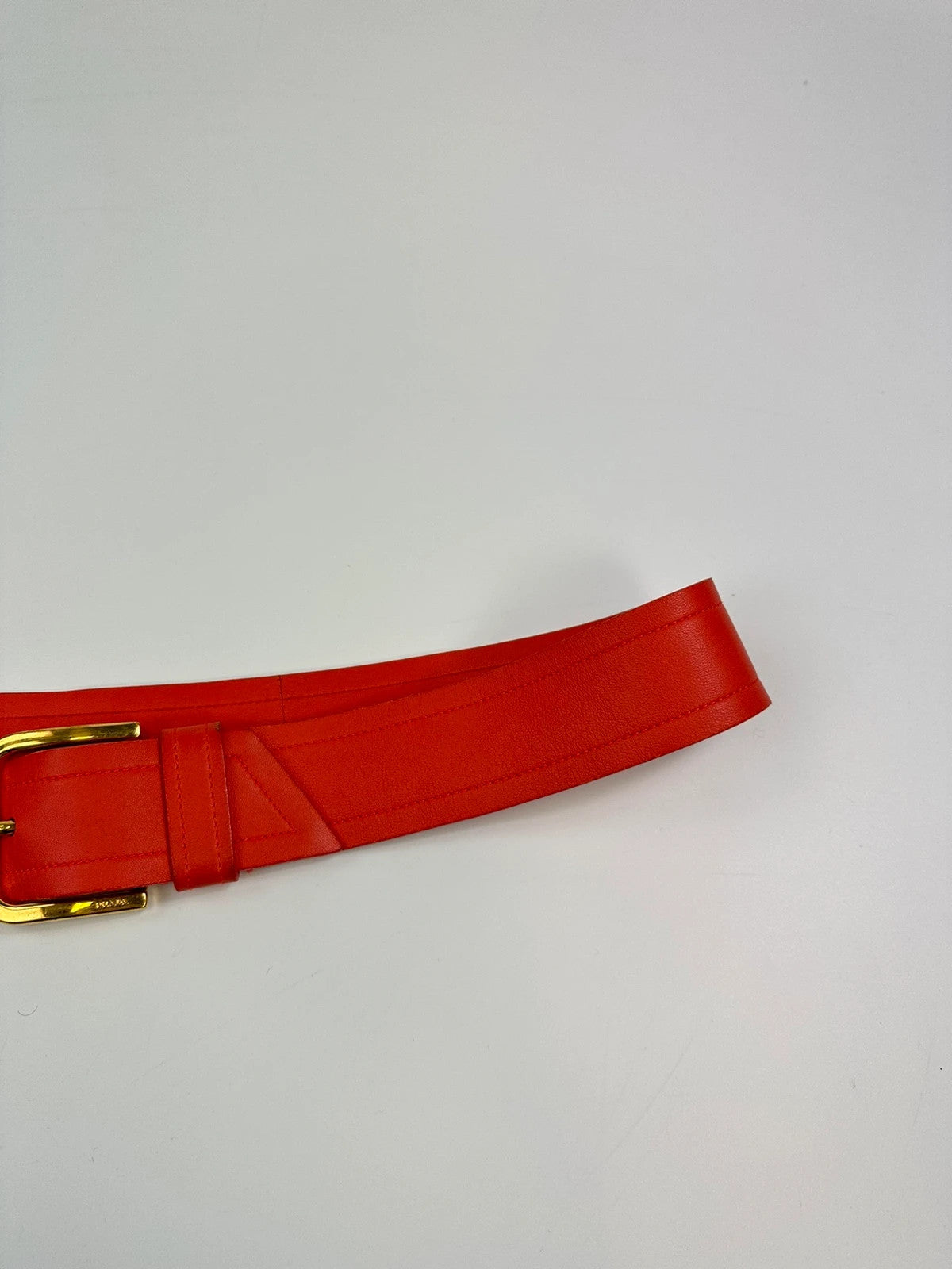 Prada burgundy leather belt with large rose gold buckle, vintage 2010 collection.