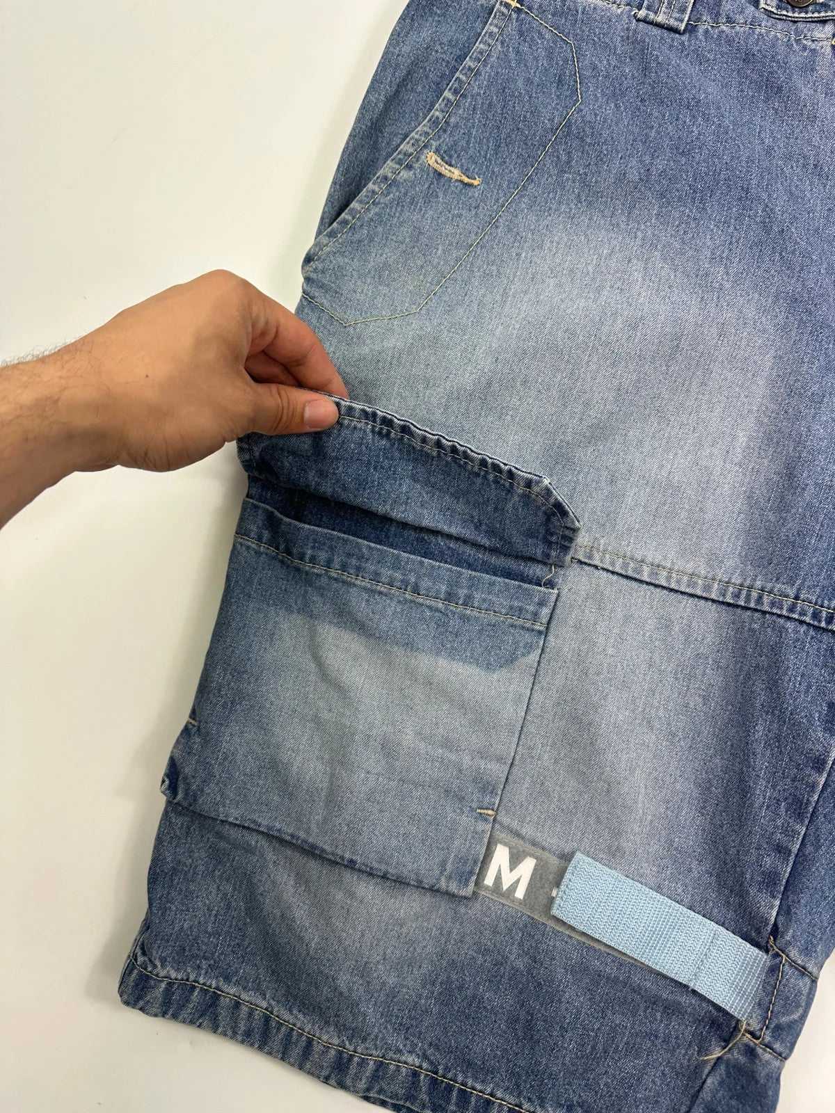 Marithé Francois Girbaud blue baggy denim shorts with cargo pockets and adjustable scratch detail.