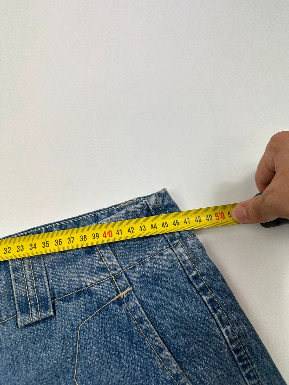 Marithé Francois Girbaud blue baggy denim shorts with cargo pockets and adjustable scratch detail.