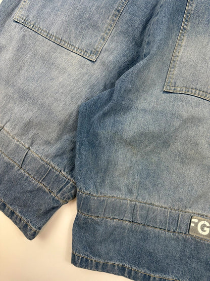 Marithé Francois Girbaud blue baggy denim shorts with cargo pockets and adjustable scratch detail.