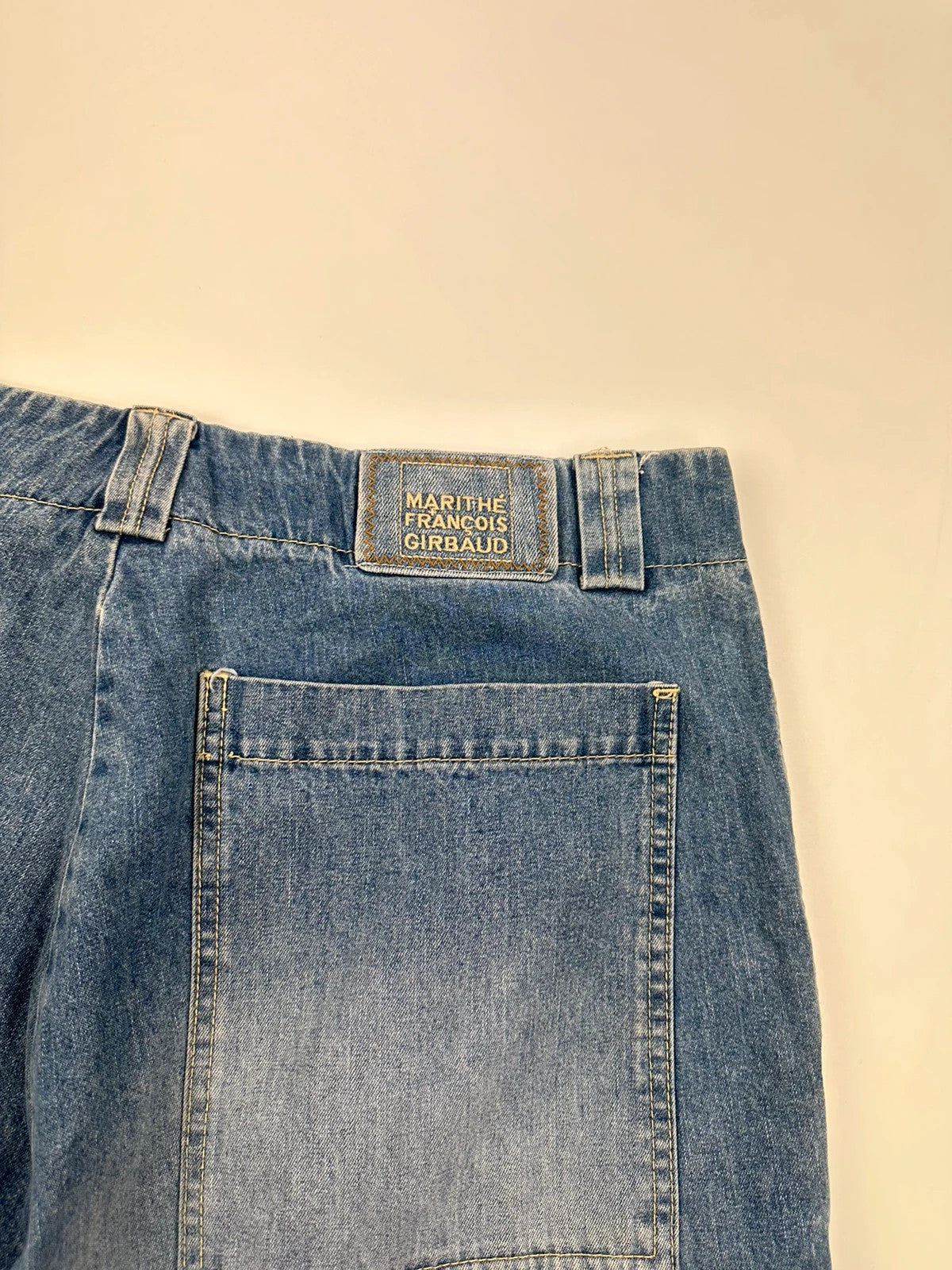 Marithé Francois Girbaud blue baggy denim shorts with cargo pockets and adjustable scratch detail.