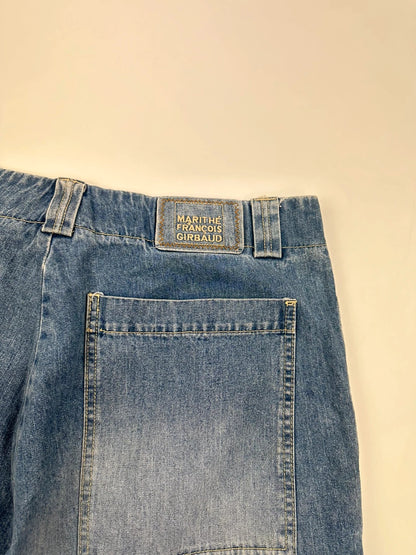Marithé Francois Girbaud blue baggy denim shorts with cargo pockets and adjustable scratch detail.