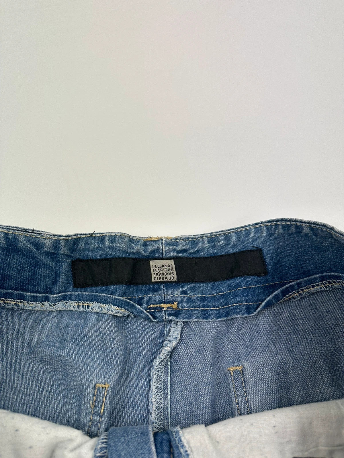 Marithé Francois Girbaud blue baggy denim shorts with cargo pockets and adjustable scratch detail.
