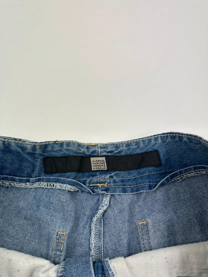 Marithé Francois Girbaud blue baggy denim shorts with cargo pockets and adjustable scratch detail.