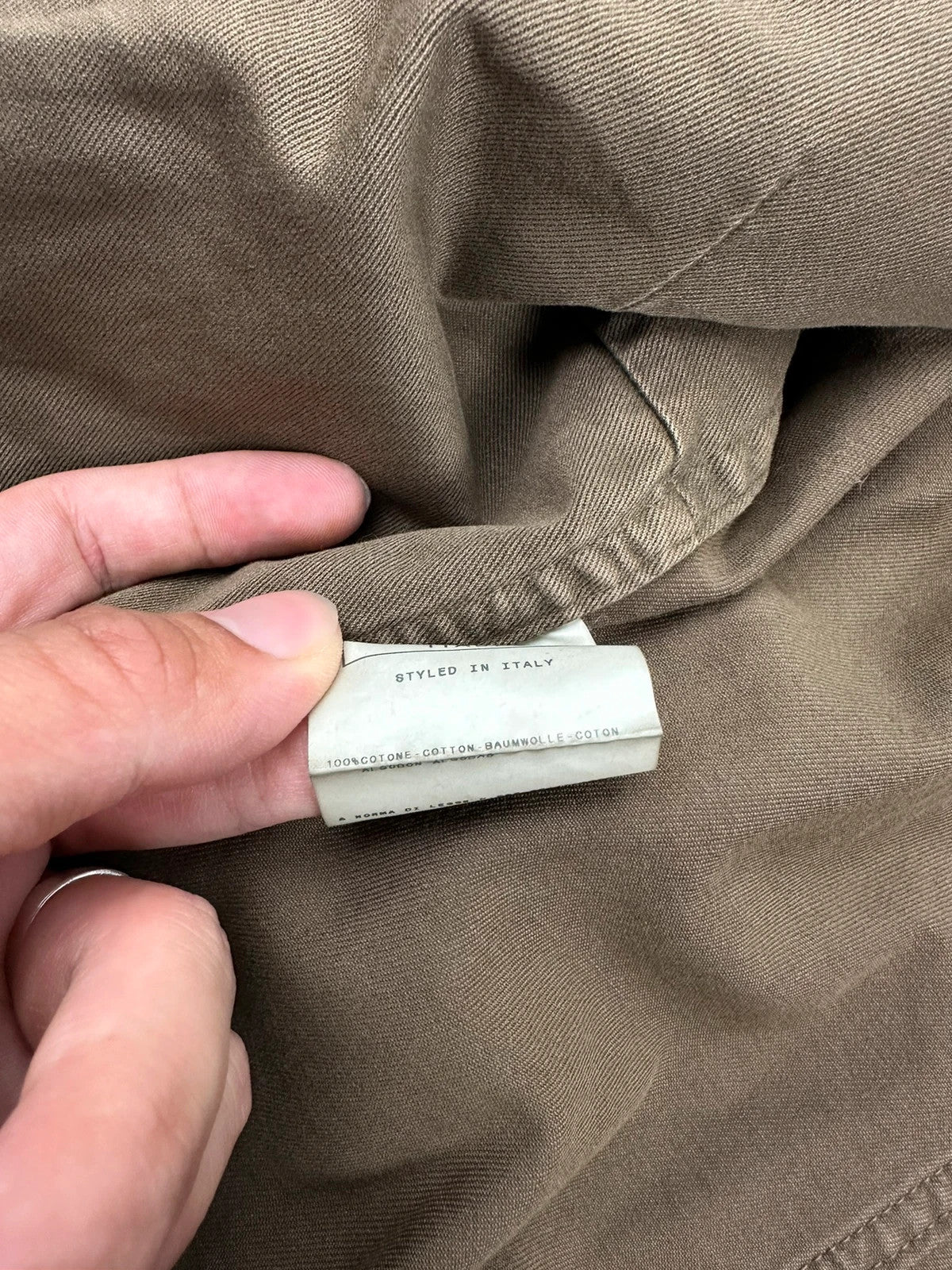 Dolce & Gabbana khaki crop jacket with army mesh pockets and logo detail.