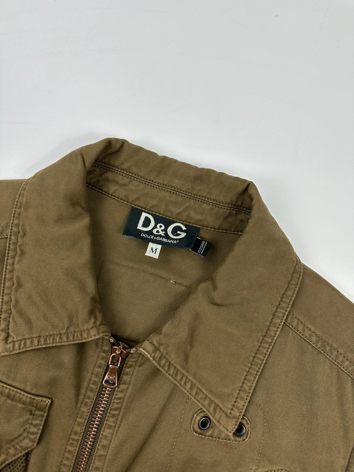 Dolce & Gabbana khaki crop jacket with army mesh pockets and logo detail.