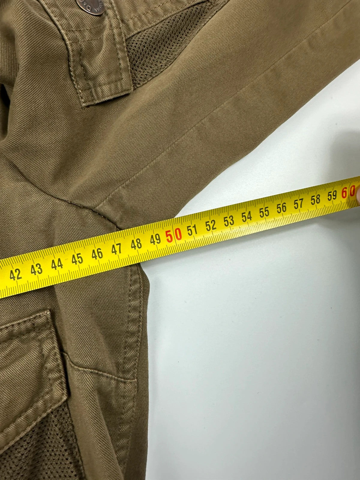 Dolce & Gabbana khaki crop jacket with army mesh pockets and logo detail.