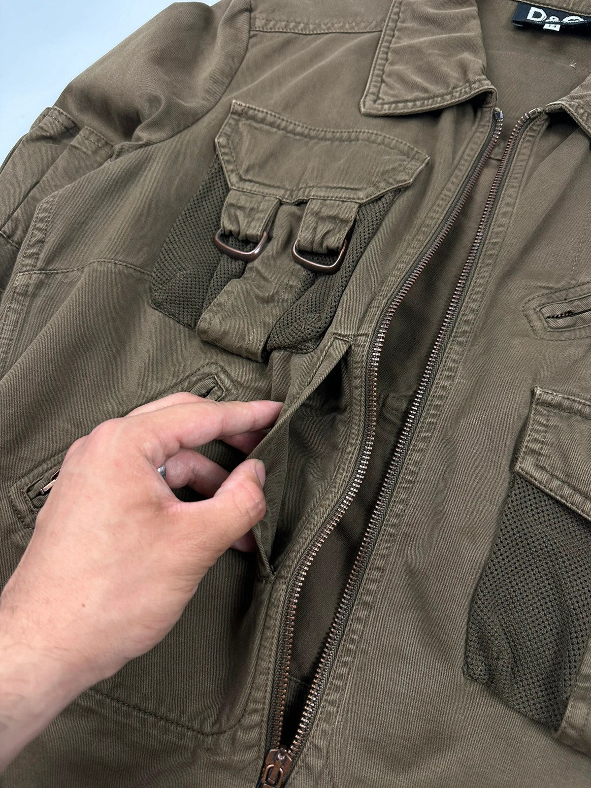 Dolce & Gabbana khaki crop jacket with army mesh pockets and logo detail.