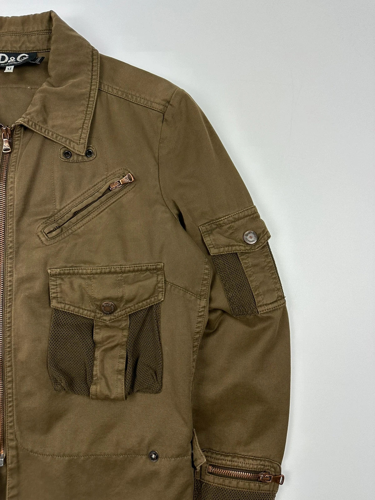 Dolce & Gabbana khaki crop jacket with army mesh pockets and logo detail.