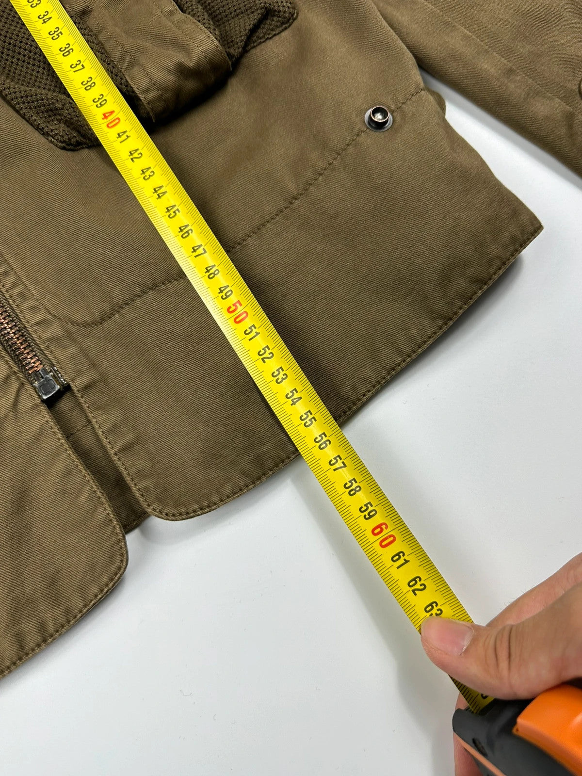 Dolce & Gabbana khaki crop jacket with army mesh pockets and logo detail.