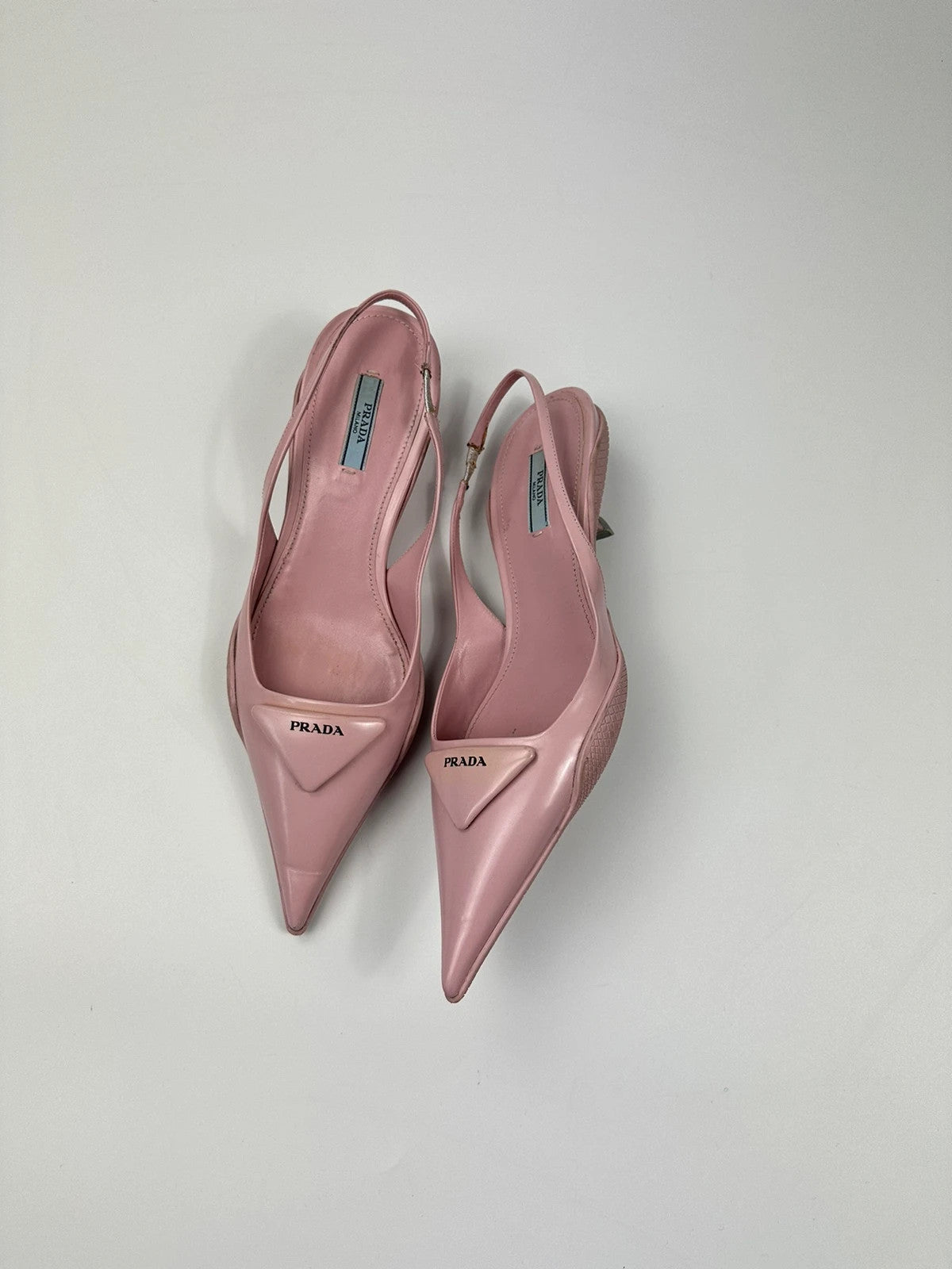 Prada pink leather heels with pointed toe and logo detail from SS2021 collection.