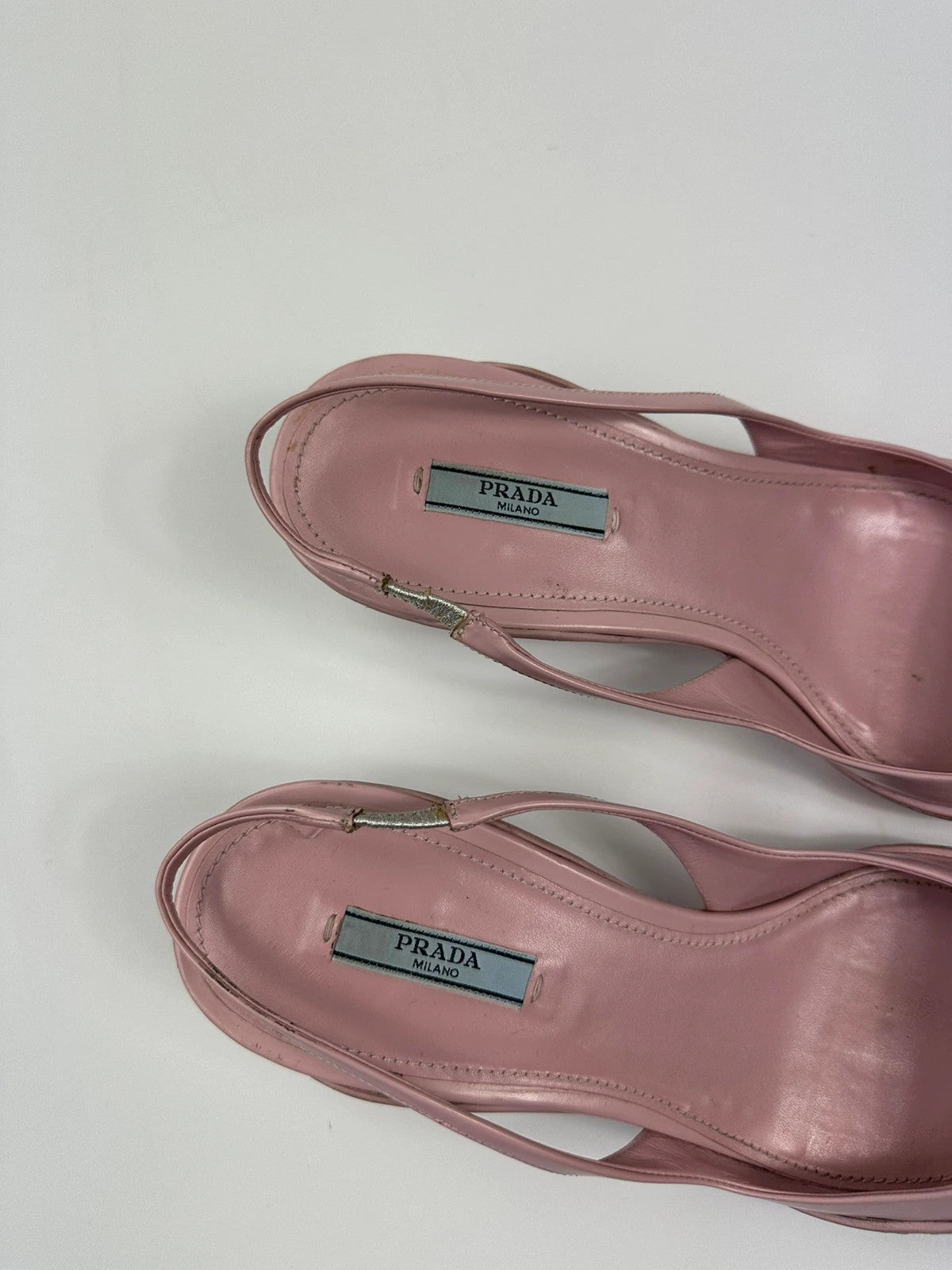 Prada pink leather heels with pointed toe and logo detail from SS2021 collection.