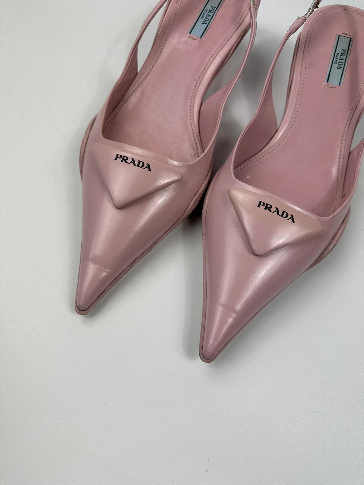 Prada pink leather heels with pointed toe and logo detail from SS2021 collection.