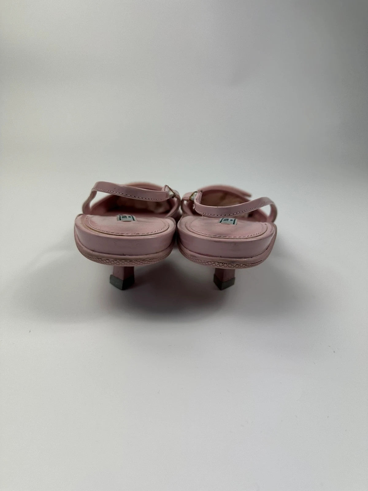 Prada pink leather heels with pointed toe and logo detail from SS2021 collection.