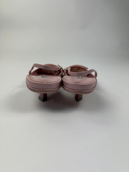 Prada pink leather heels with pointed toe and logo detail from SS2021 collection.