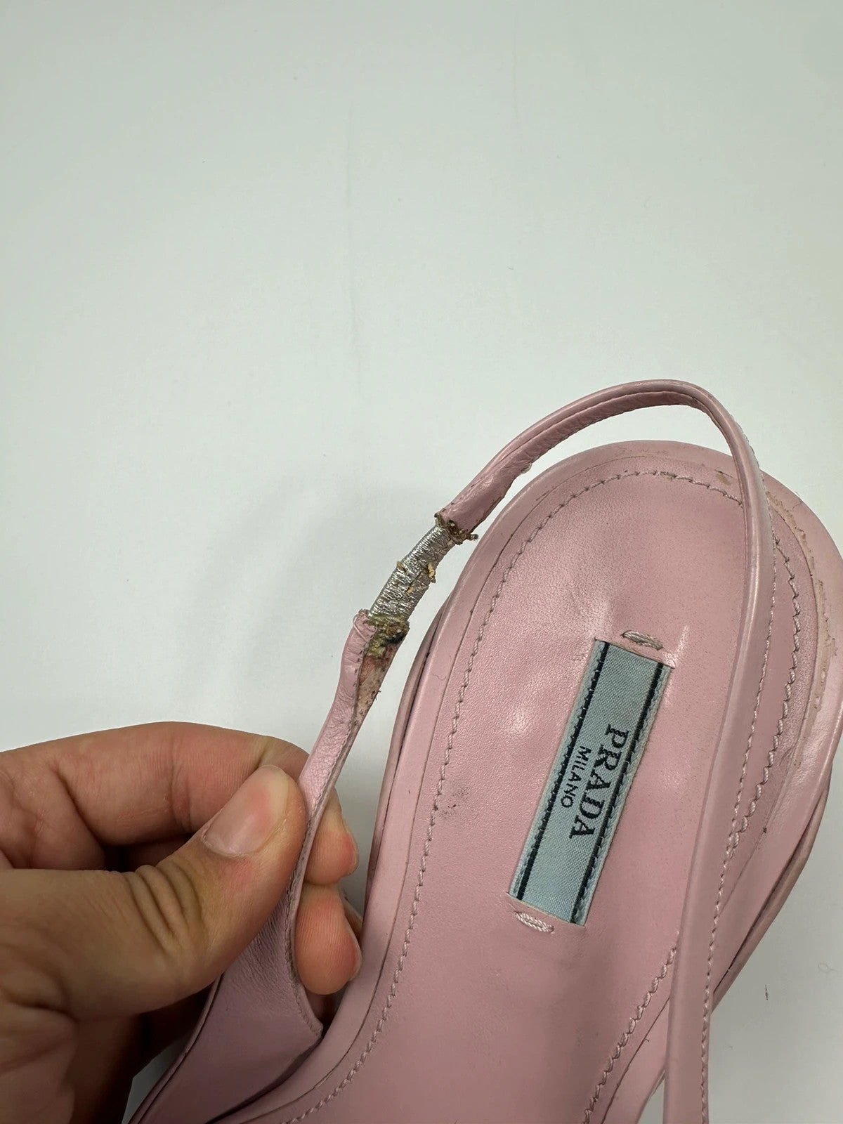 Prada pink leather heels with pointed toe and logo detail from SS2021 collection.