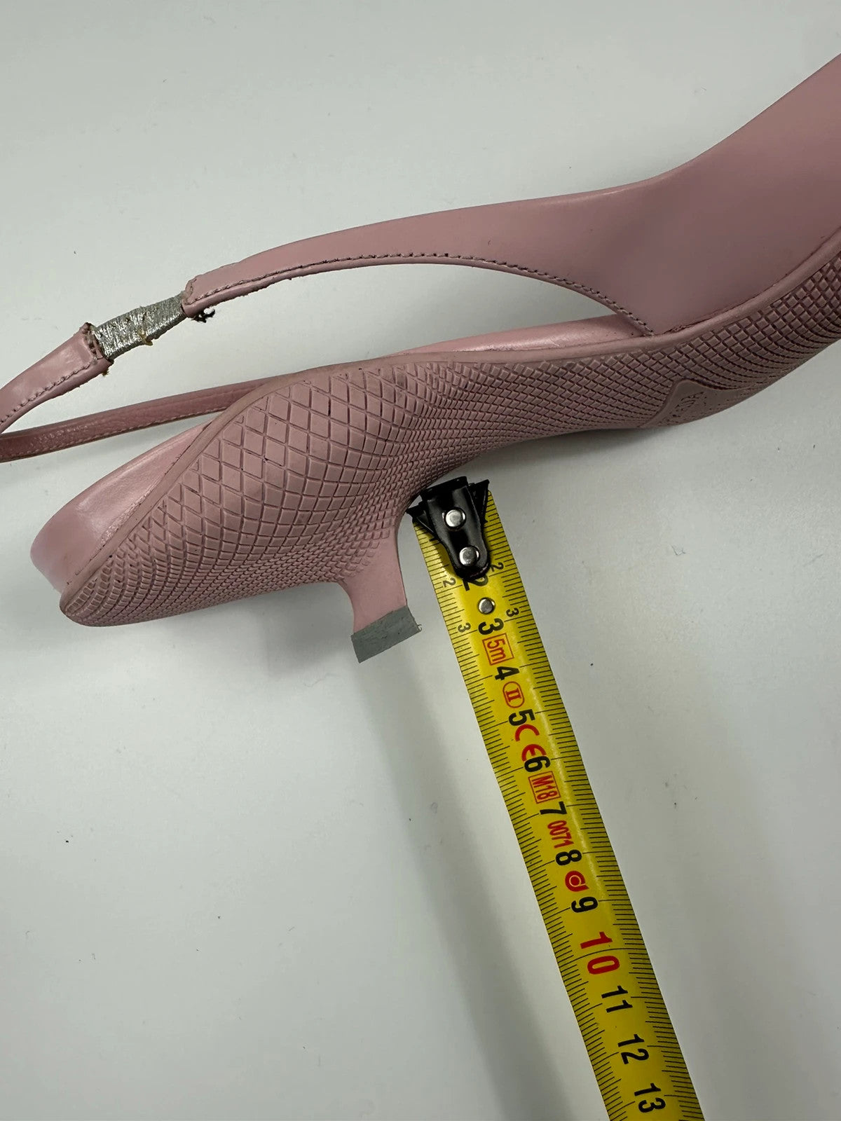Prada pink leather heels with pointed toe and logo detail from SS2021 collection.