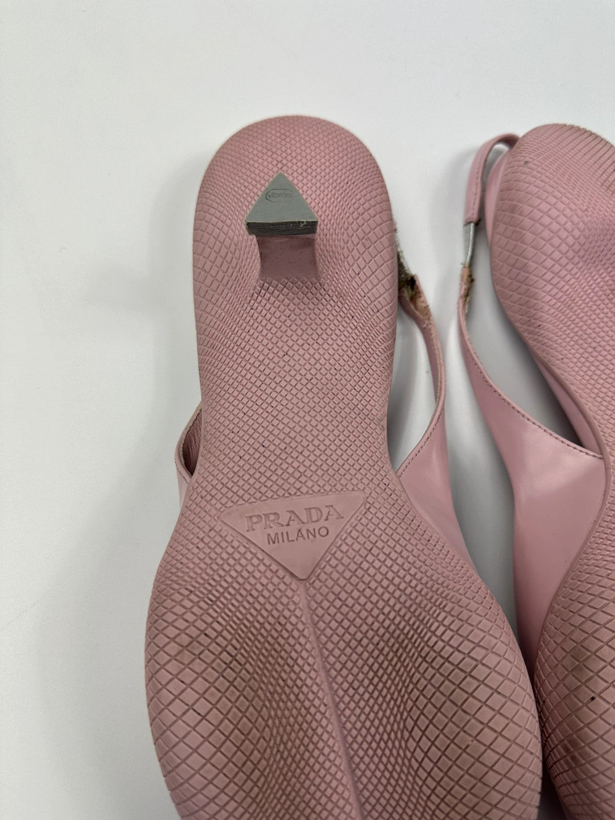 Prada pink leather heels with pointed toe and logo detail from SS2021 collection.