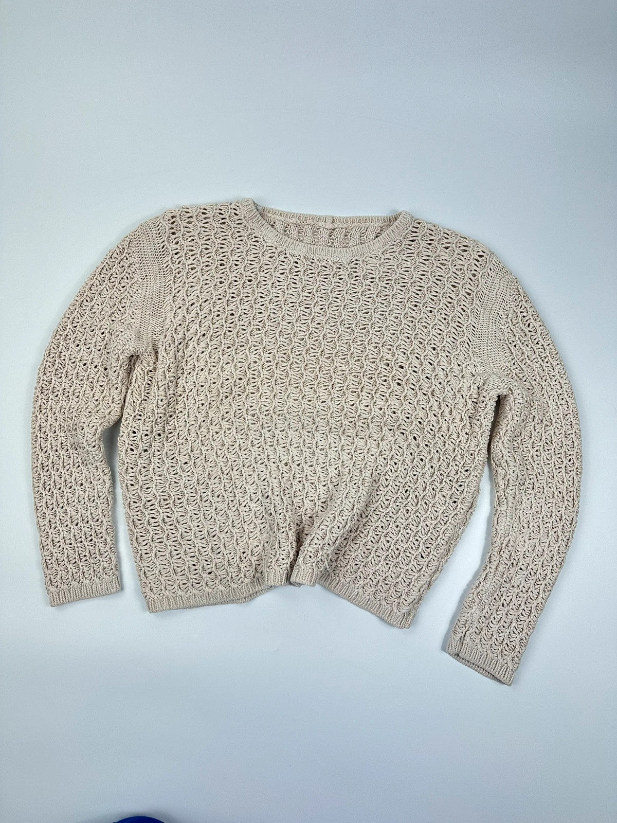 Prada beige silk knit sweater with intricate openwork design and subtle sheen.