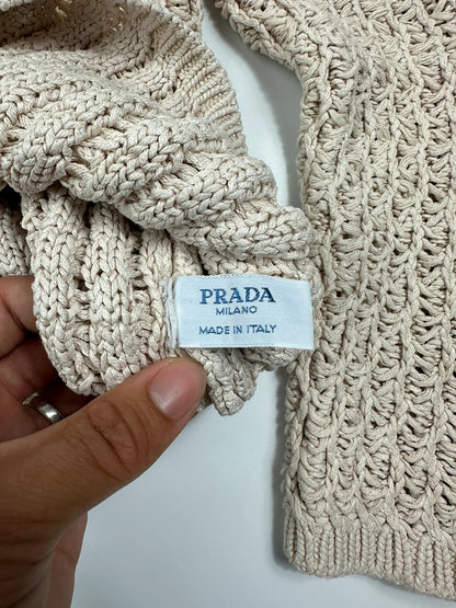 Prada beige silk knit sweater with intricate openwork design and subtle sheen.