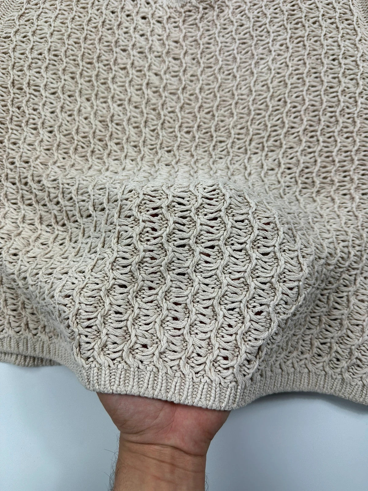 Prada beige silk knit sweater with intricate openwork design and subtle sheen.