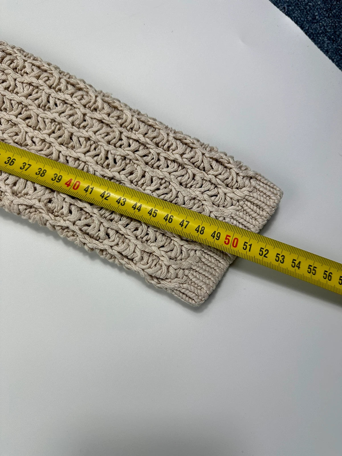 Prada beige silk knit sweater with intricate openwork design and subtle sheen.