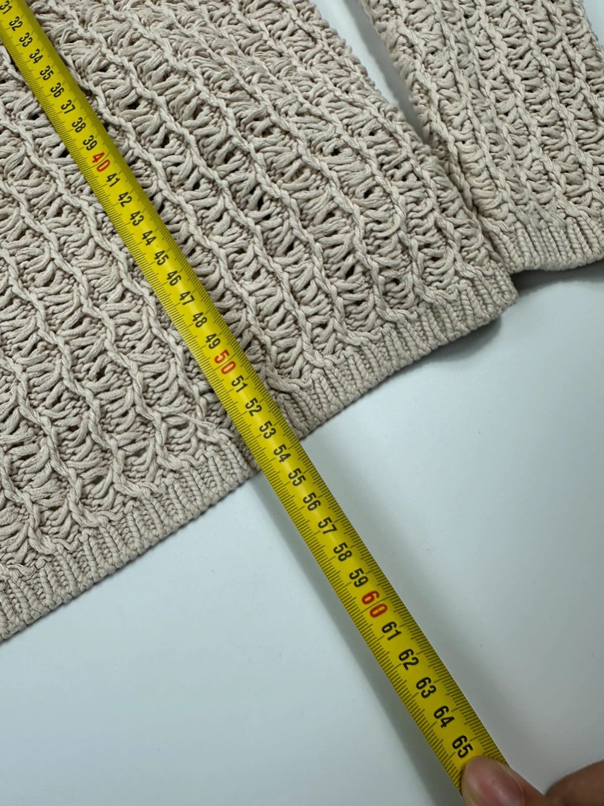 Prada beige silk knit sweater with intricate openwork design and subtle sheen.