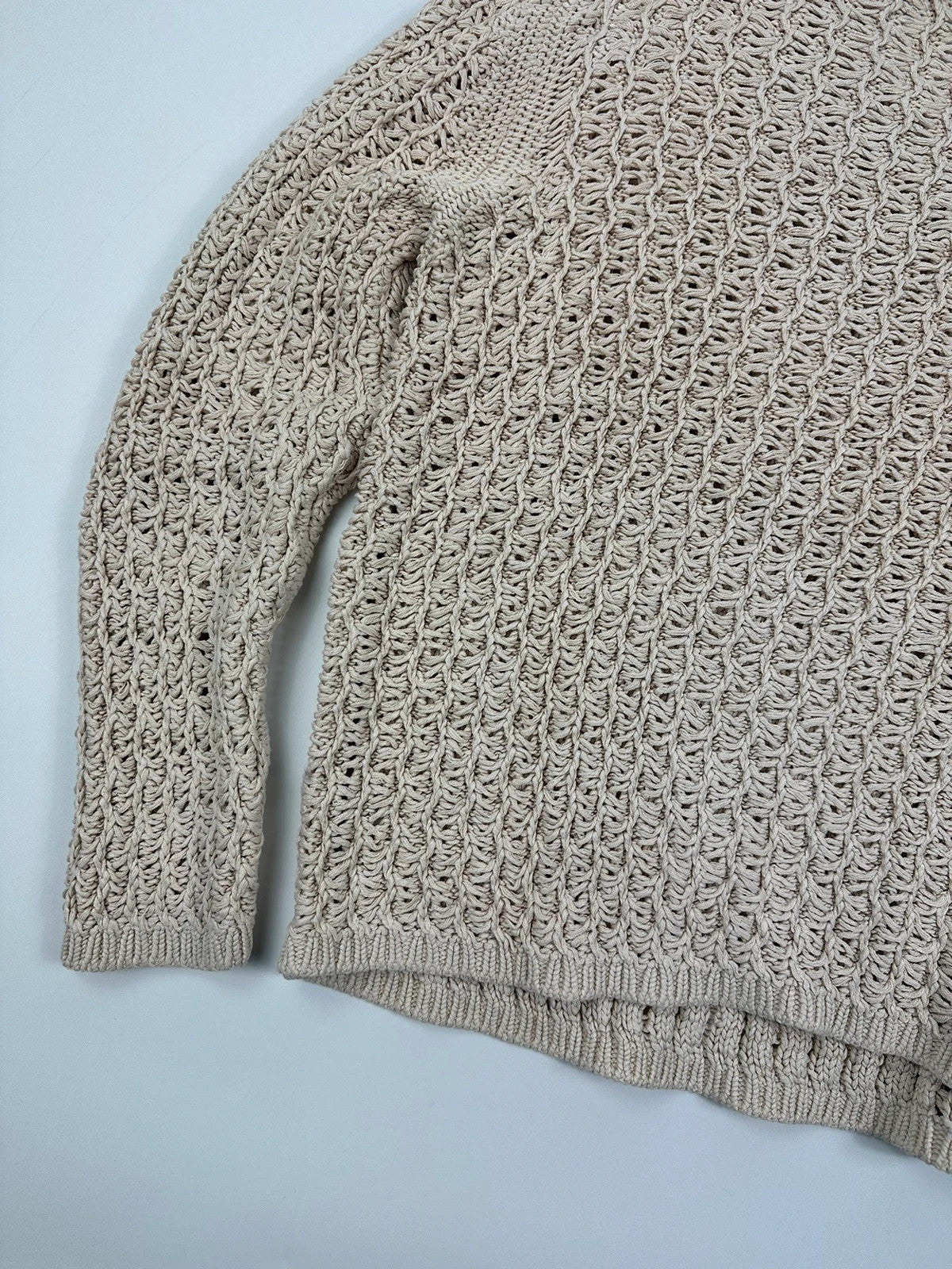 Prada beige silk knit sweater with intricate openwork design and subtle sheen.