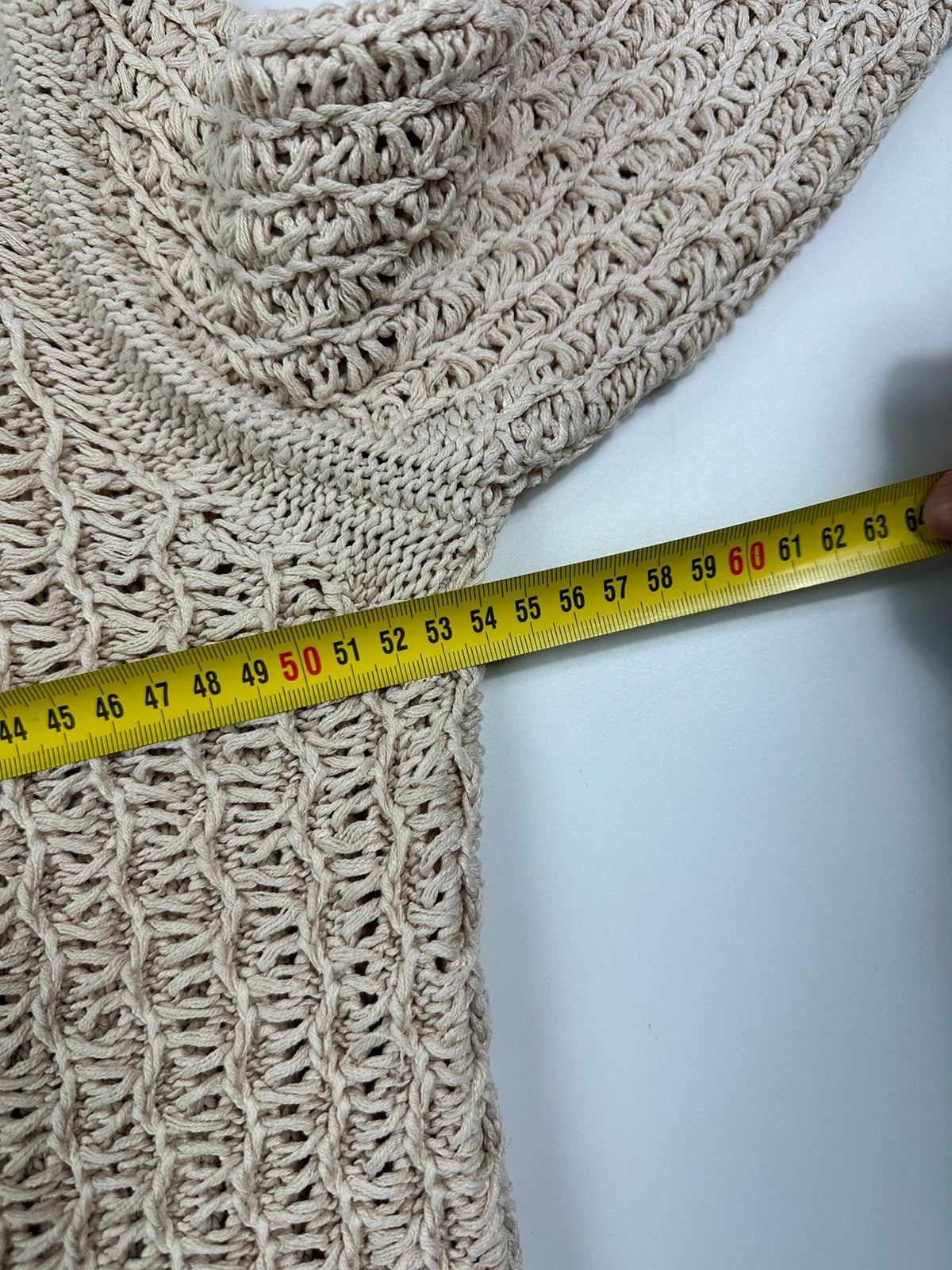 Prada beige silk knit sweater with intricate openwork design and subtle sheen.