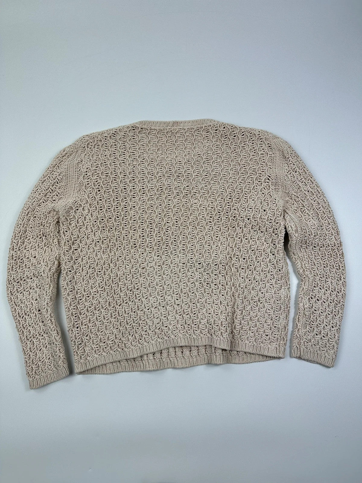 Prada beige silk knit sweater with intricate openwork design and subtle sheen.