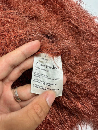 Acne Studios oversized cropped sweater in red and orange hairy knit texture.