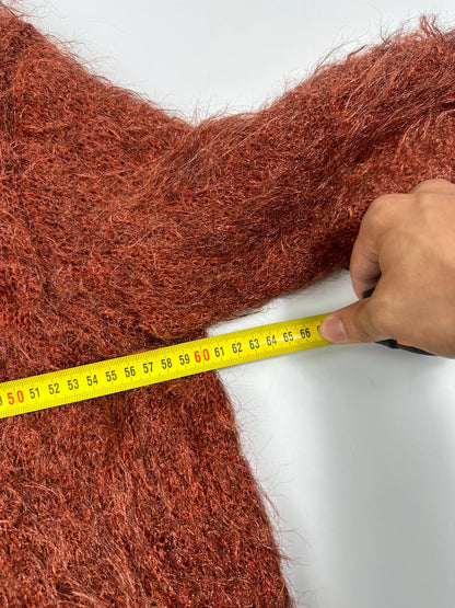 Acne Studios oversized cropped sweater in red and orange hairy knit texture.