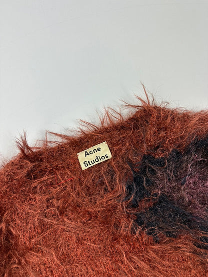 Acne Studios oversized cropped sweater in red and orange hairy knit texture.