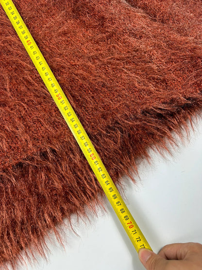 Acne Studios oversized cropped sweater in red and orange hairy knit texture.