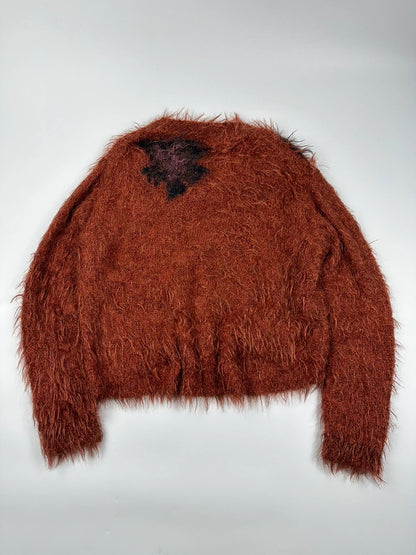 Acne Studios oversized cropped sweater in red and orange hairy knit texture.