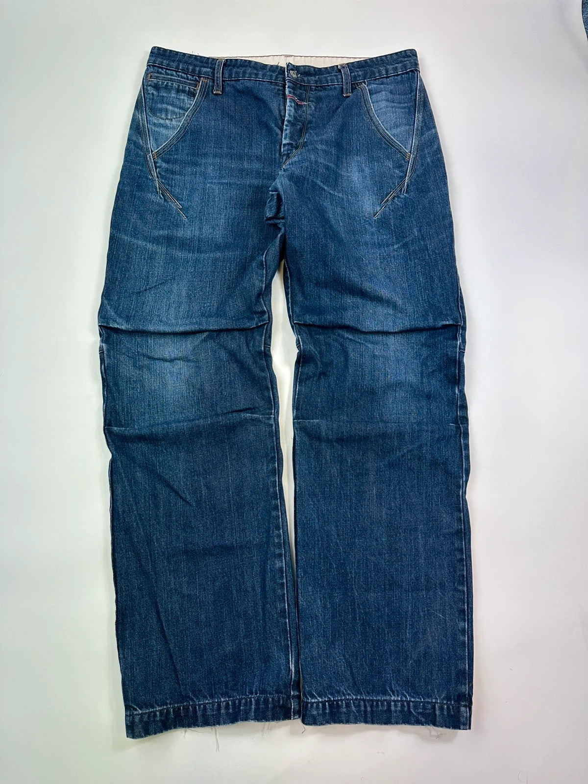 Marithé François Girbaud blue baggy jeans with wide legs and vintage 90s style.