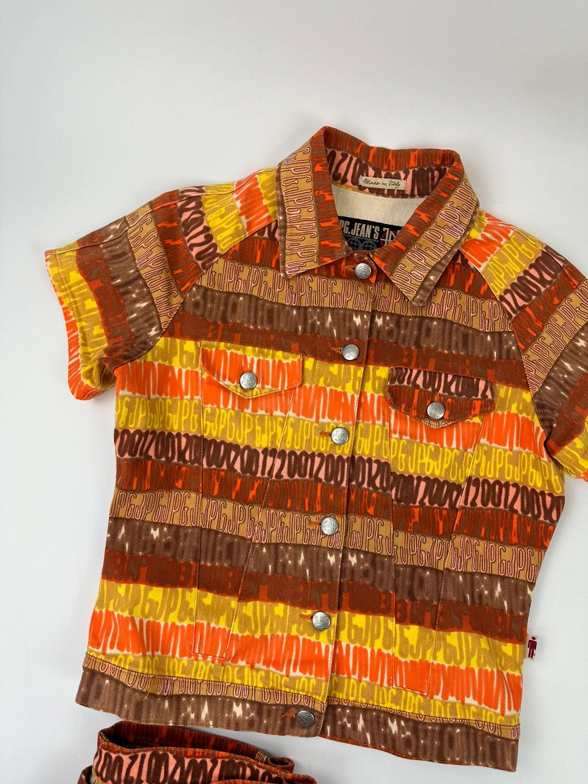 Jean-Paul Gaultier orange red monogram short sleeve shirt and denim pants set.