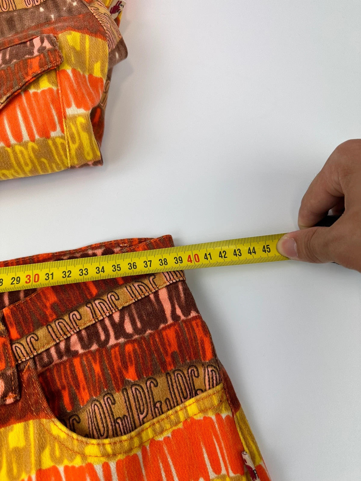 Jean-Paul Gaultier orange red monogram short sleeve shirt and denim pants set.
