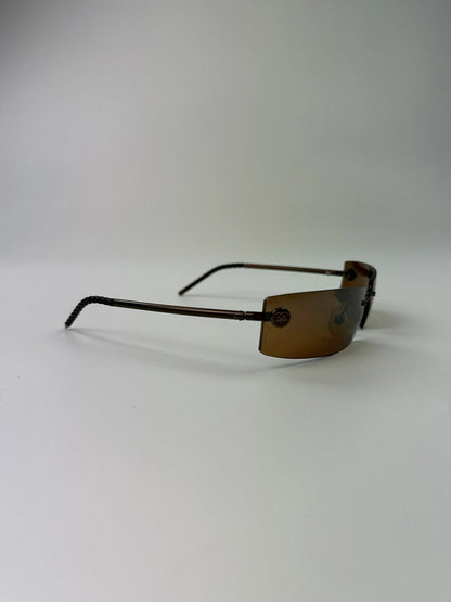 Chanel brown and orange rimless sunglasses with double CC logo detail.